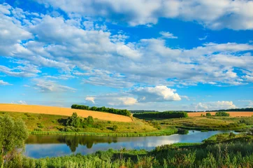 Wall murals Summer Sunny summer landscape with river,fields,green hills and beautiful clouds in blue sky.