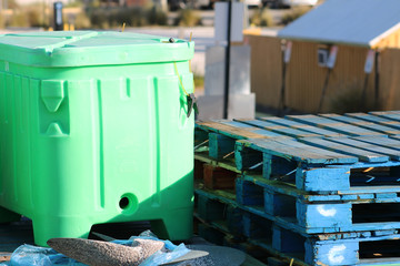 A fish tub, pallets, and a boat propeller on a pier, Madeira Beach, Florida