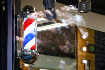 classic barber shop sign in the form of a white-blue-red spiral
