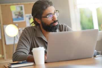 Start-up entrepreneur working on laptop