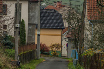 Old houses in Preckovice village in autumn dark day