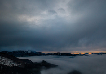 Naklejka na ściany i meble Fog in sunrise View from the top of the Mountain