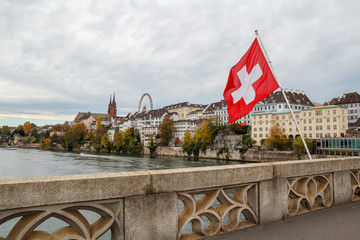 Swiss flag over the river Rhine in Basel, Switzerland