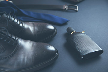 man accessorise on dark background