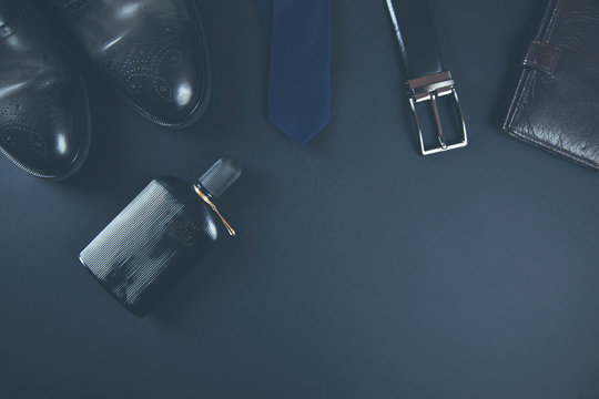 man accessorise on dark background