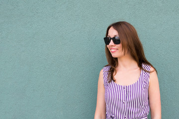 Fototapeta premium Cheerful young woman in glasses