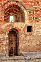 Abandoned red brick builiding doorway. fortress in belarus