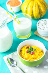 Delicious homemade pumpkin porridge with cranberry and mint