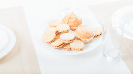 biscuits and cupcakes on plate. food snacks and pastry.