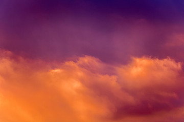A multicolored bright sky with clouds during the sunrise or sunset_