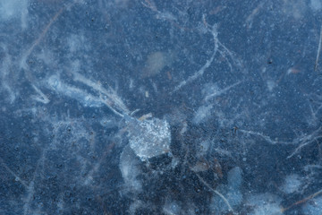 blue ice on pond winter background texture