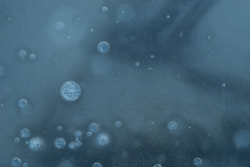 blue ice on pond winter background texture