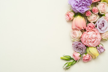 colorful flower composition on white background. roses and eustoma layout
