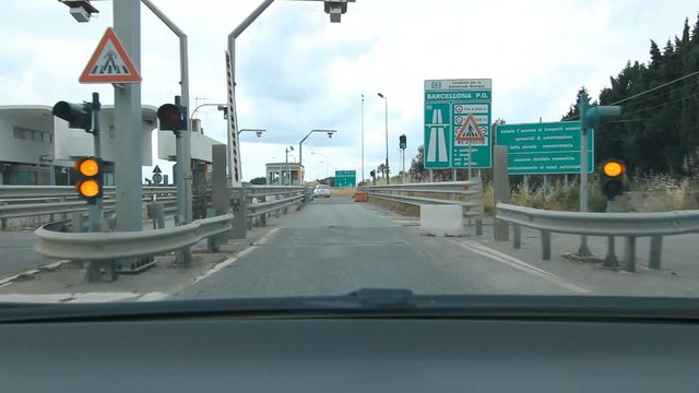 SICILY, ITALY on MAY 25th: Toll booth leaving Barcellona Pozzo di Gotto in Sicily, Italy. Barcellona Pozzo di Gotto is a town and comune of about 50,000 inhabitants in the north coast of Sicily, Italy
