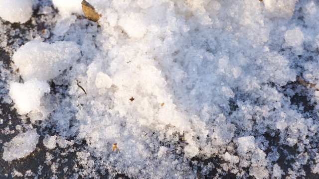 First snow in the park. Asphalt under the snow © Iryna