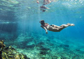diver dives underwater, diver swims down to the bottom, snorkeling