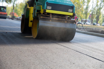 Works road roller with asphalt