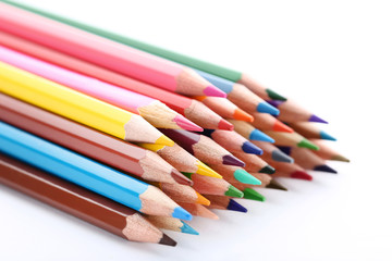 Colored pencils on white background