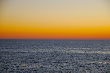 Beautiful neutral background. Sea with waves at sunset on a spring day.