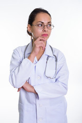 Fototapeta premium Studio shot of beautiful woman doctor thinking while looking at 