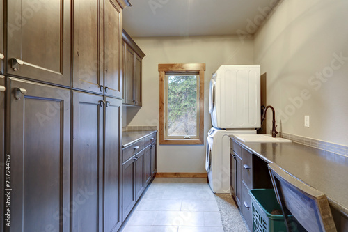 Laundry Room With Lots Of E And Floor To Ceiling Dark Cabinets Laundry Room With Lots Of E And Floor To Ceiling Dark Cabinets