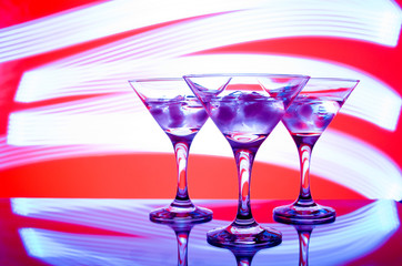 alcoholic glass in the club entourage, copy space, red background