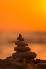 stack of zen stones on pebble beach