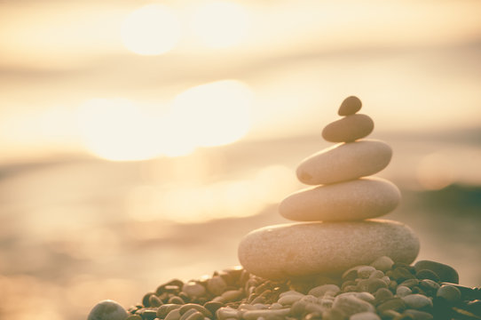 stack of zen stones on pebble beach