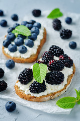 Blueberry and blackberry ricotta rye sandwiches