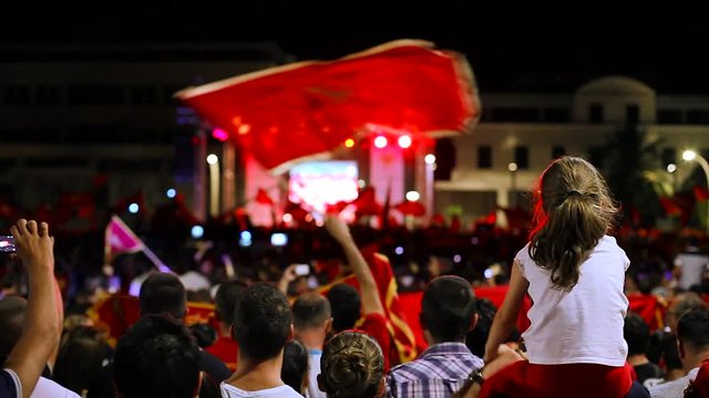 Fans celebrating the victory of their national team at the street