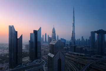 Dubai skyline in the morning, aerial top view to downtown city center landmarks at sunrise. Famous viewpoint, United Arab Emirates