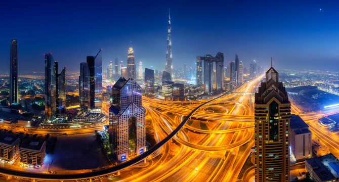 Dubai Skyline At Night, Panoramic Aerial Top View To Downtown City Center Landmarks. Famous Viewpoint, United Arab Emirates