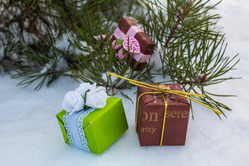 Great packages. Lying on a green fir. Winter day The eve of the new year