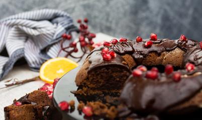 Cake with Chocolate Glaze and Pomegranate Seeds. Close up