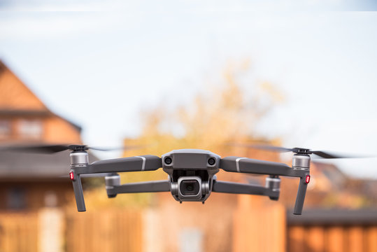 A flight of drons behind a blurred background shot with a forward