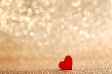 Red wooden heart on lights background