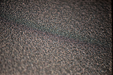 Textured surface of painted metal with powder coating. Fine texture metal surface