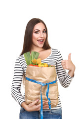 Beautiful woman holding grocery shopping bag on white background