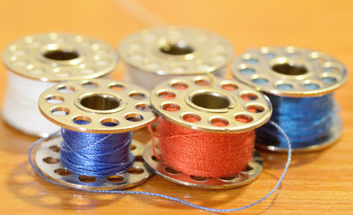 Coil with a sewing thread.