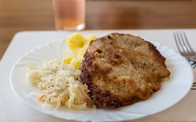 pork chop with potatoes and salad