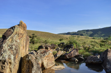 Fototapeta na wymiar rocks in the river under the sun