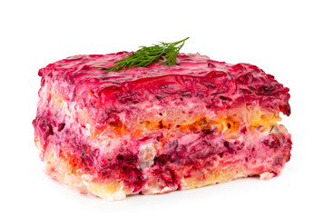 Salad herring under fur coat with parsley close - up on a white background.
