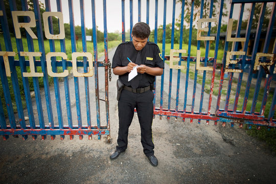 View of a security guard near a gate.