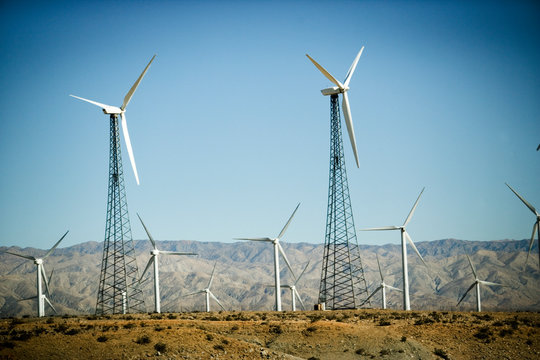 Group of wind turbines in a field.