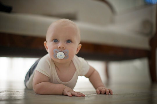 Young baby lying on his stomach.