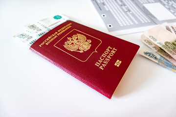 Russian passport, money and registration at the place of stay form on the table