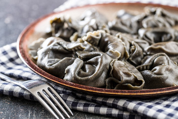 Squid ink tortellini pasta.