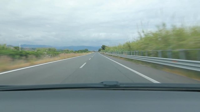 Travelling west on Autostrada E90 on the north coast of Sicily, Italy. Just west of Barcellona Pozzo di Gotto.