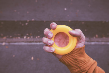 Male hand grips anti-stress rubber ring