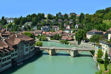 Fototapeta na wymiar Panorama of the river Aare in Bern, azure water, bridge, houses, blue sky.